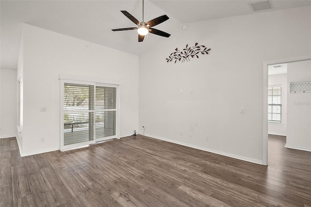 unfurnished room featuring ceiling fan, dark wood-type flooring, and high vaulted ceiling