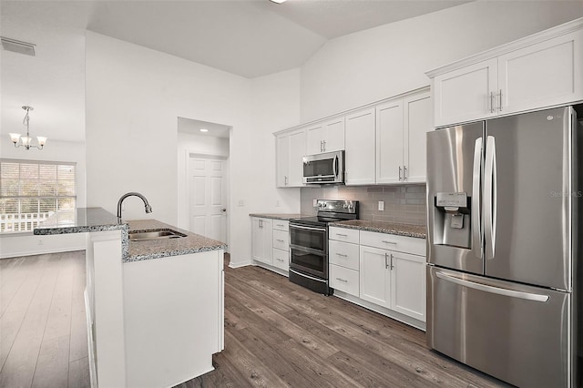 kitchen featuring white cabinetry, stainless steel appliances, dark wood-type flooring, and sink