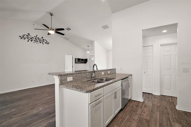 kitchen with white cabinetry, dark wood-type flooring, stainless steel dishwasher, and sink