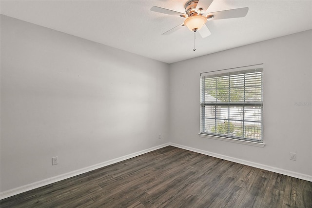 empty room featuring dark hardwood / wood-style floors and ceiling fan