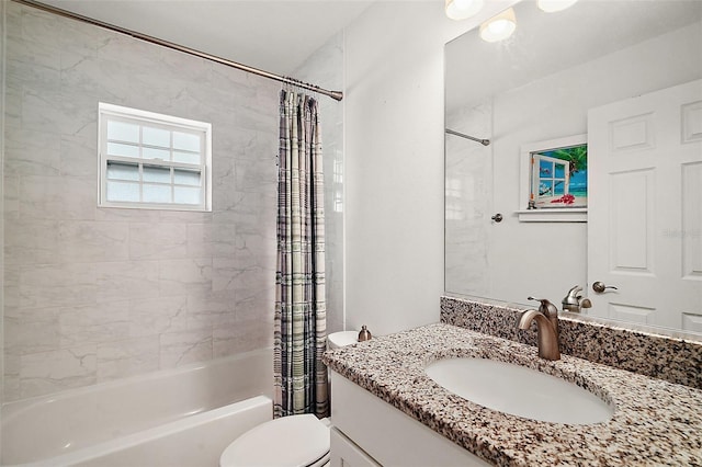 full bathroom featuring vanity, toilet, and shower / bath combination with curtain