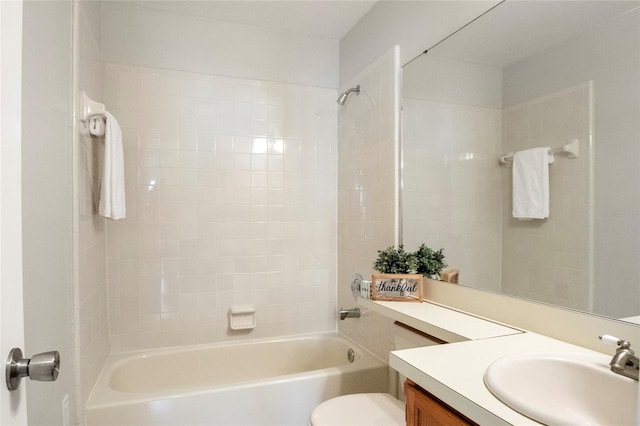 bathroom with toilet, washtub / shower combination, and vanity