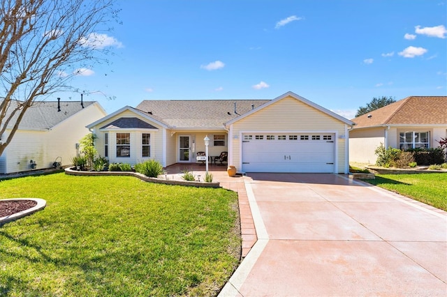 ranch-style home with a garage, concrete driveway, and a front lawn