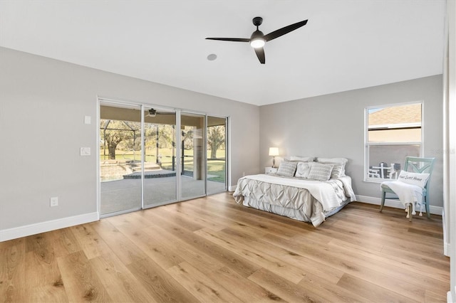 bedroom featuring light wood-type flooring, access to outside, and ceiling fan