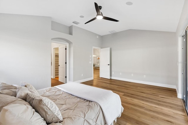 bedroom with lofted ceiling, ceiling fan, and hardwood / wood-style floors