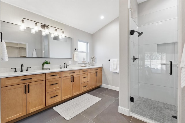 bathroom with vanity, tile patterned flooring, a shower with shower door, and vaulted ceiling