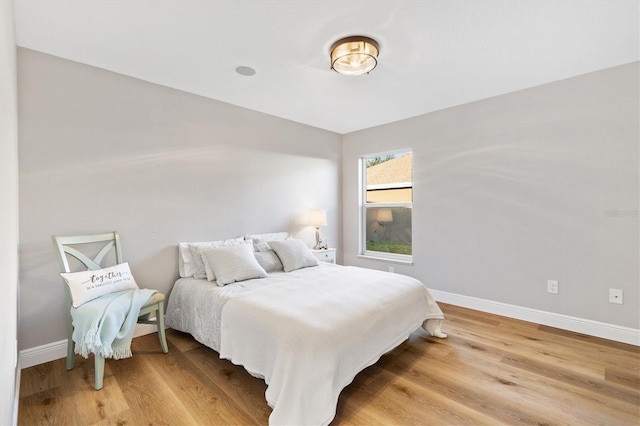 bedroom with wood-type flooring