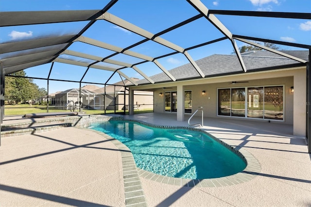 view of pool featuring ceiling fan, a lanai, and a patio area