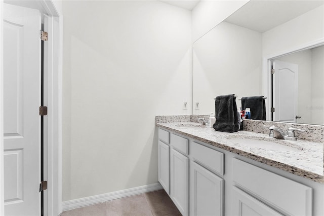bathroom with tile patterned flooring and vanity
