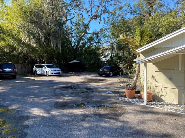 uncovered parking lot with fence