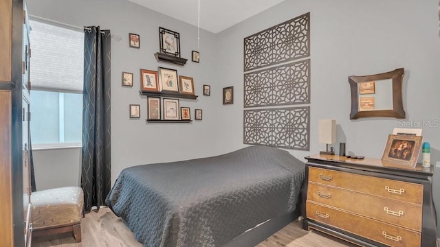 bedroom with light wood-style floors