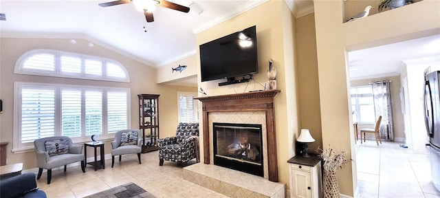 living area featuring light tile patterned floors, ornamental molding, and a wealth of natural light