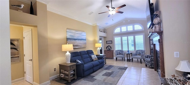 living area featuring high vaulted ceiling, light tile patterned flooring, a ceiling fan, baseboards, and crown molding