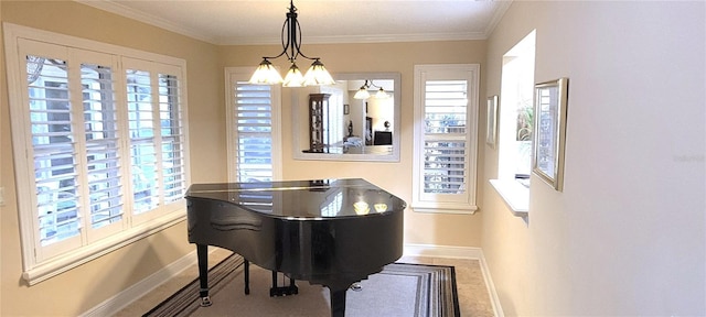 living area featuring crown molding, a notable chandelier, and baseboards