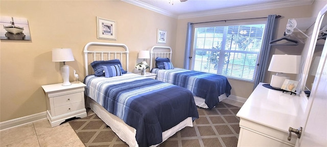 tiled bedroom with ornamental molding and baseboards