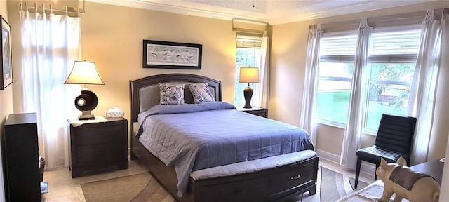 bedroom featuring multiple windows, crown molding, baseboards, and light tile patterned floors