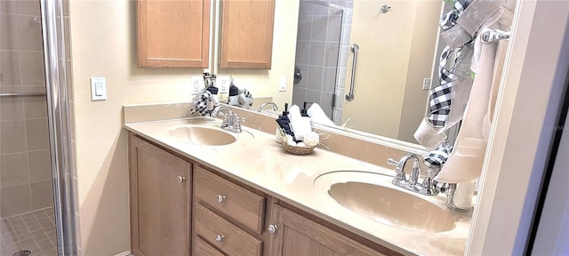 full bathroom featuring a stall shower, a sink, and double vanity