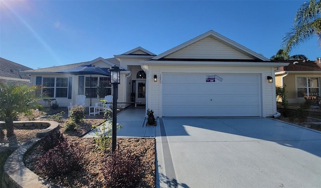 ranch-style house featuring driveway and an attached garage