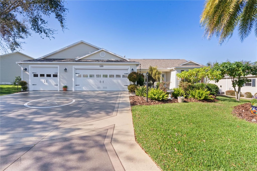1508 Lakewood Dr, The Villages, FL 32162 - ranch-style house featuring a garage, a front yard, and concrete driveway