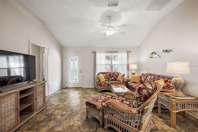 living area with vaulted ceiling, visible vents, and a ceiling fan