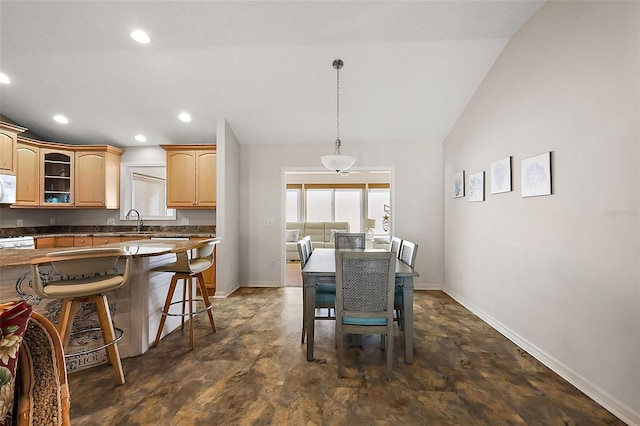 dining area with baseboards, vaulted ceiling, and recessed lighting