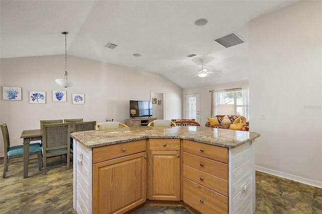 kitchen featuring light stone counters, decorative light fixtures, visible vents, open floor plan, and vaulted ceiling