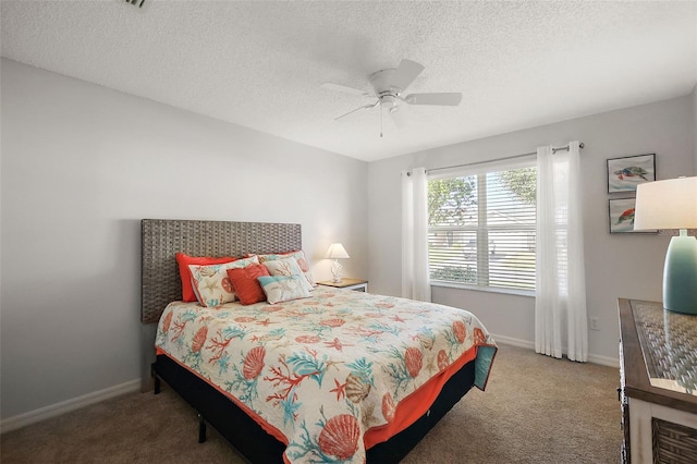 bedroom featuring carpet floors, ceiling fan, a textured ceiling, and baseboards