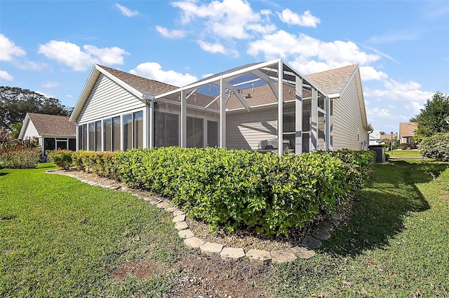 rear view of property with a lawn