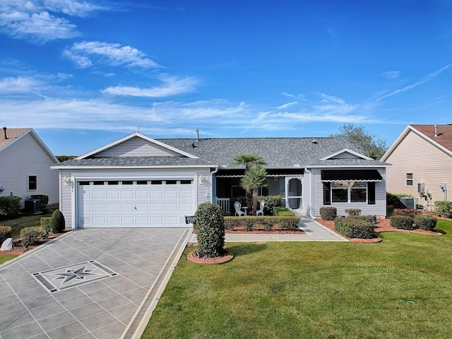 ranch-style house with central air condition unit, a shingled roof, a front yard, a garage, and driveway