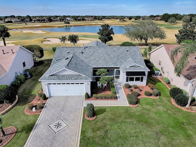 birds eye view of property with a water view and view of golf course