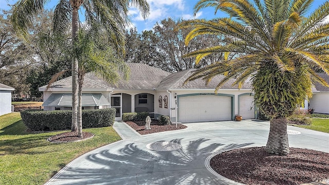 view of front of house featuring a garage, driveway, roof with shingles, stucco siding, and a front yard