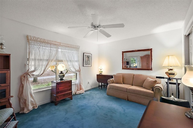 living room with ceiling fan, a textured ceiling, carpet, and baseboards