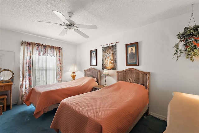 carpeted bedroom featuring ceiling fan and a textured ceiling