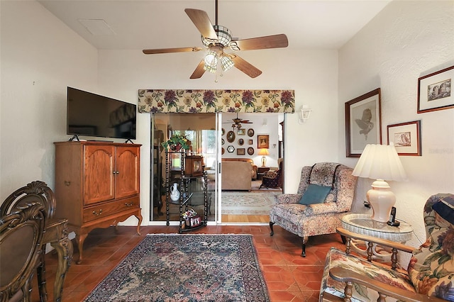 tiled living room featuring ceiling fan