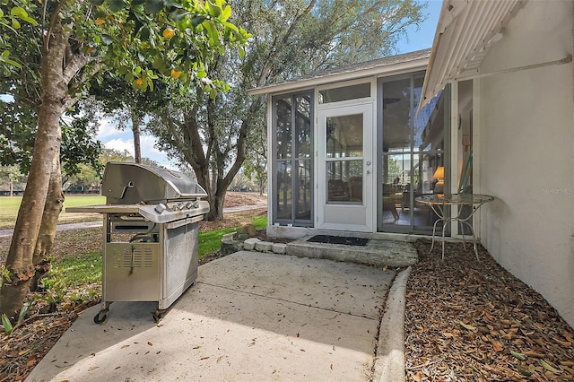 entrance to property with stucco siding and a patio