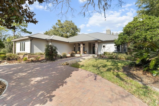 ranch-style home with a front lawn