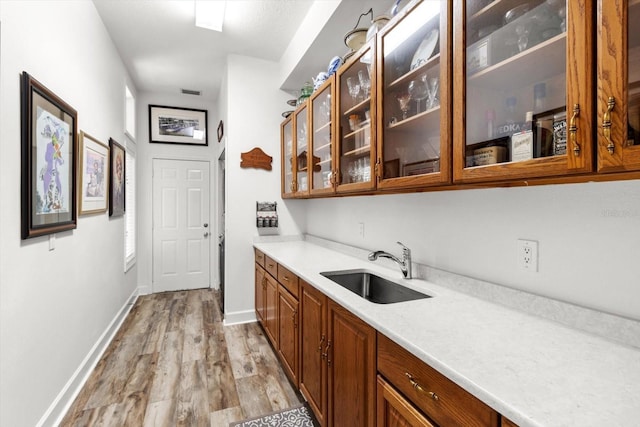 kitchen featuring sink and light hardwood / wood-style floors