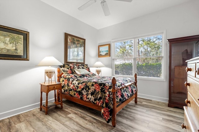 bedroom with light wood-type flooring and ceiling fan