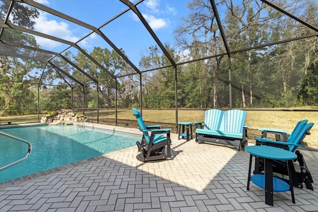 view of pool featuring a lanai and a patio area