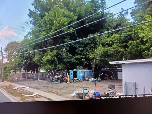 view of property's community featuring fence