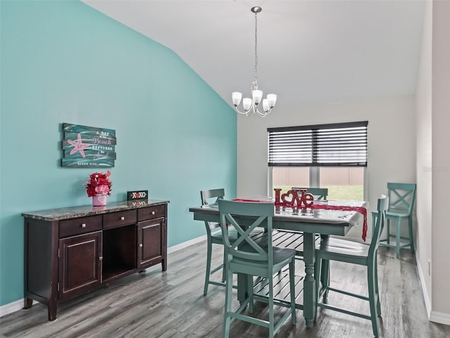 dining space with lofted ceiling, light wood-type flooring, baseboards, and a notable chandelier