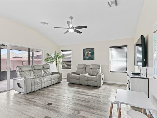 living room with vaulted ceiling, ceiling fan, light wood-style flooring, and visible vents