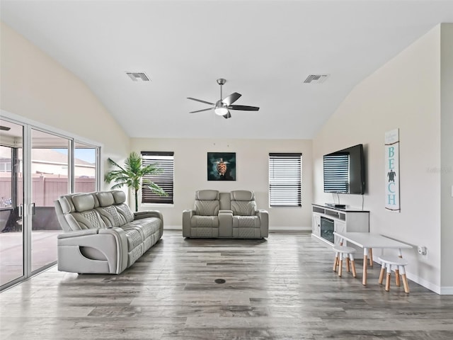 living area featuring ceiling fan, wood finished floors, and visible vents