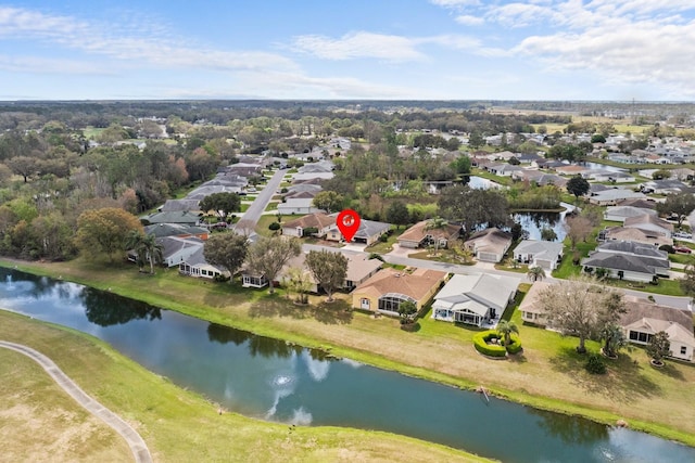 drone / aerial view featuring a water view and a residential view