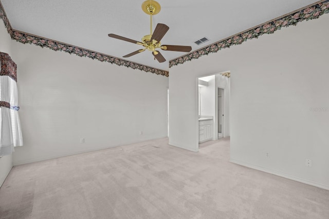 unfurnished room featuring visible vents, ceiling fan, and carpet flooring