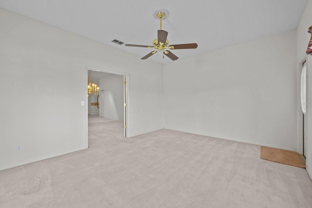 unfurnished bedroom with ceiling fan with notable chandelier, carpet flooring, and visible vents