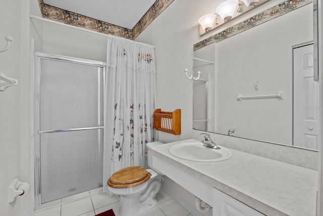 full bathroom featuring toilet, a stall shower, vanity, a textured ceiling, and tile patterned floors