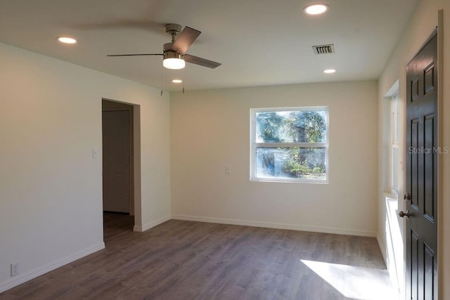 unfurnished room with ceiling fan and wood-type flooring