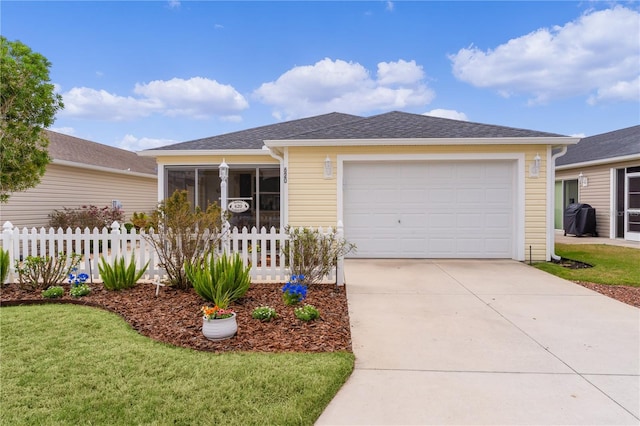 ranch-style home with an attached garage, fence, concrete driveway, roof with shingles, and a front lawn