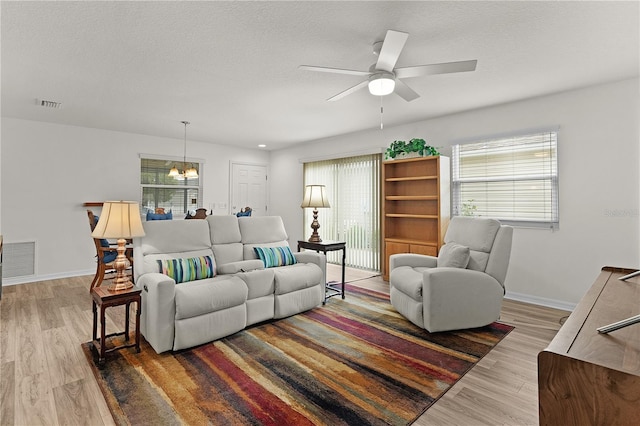 620 Vagabond St, The Villages, FL 32163 - living area with visible vents, baseboards, and wood finished floors